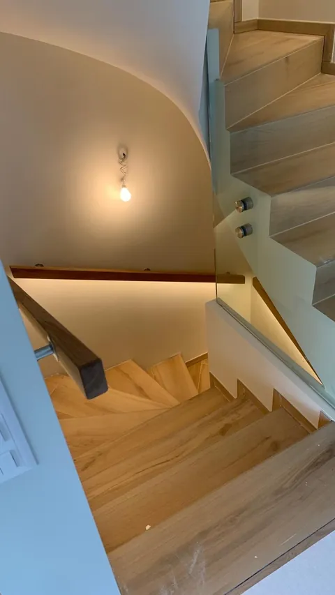 Bespoke wooden staircase seen from the landing