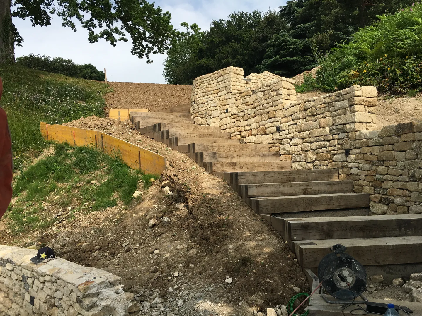 Outdoor steps and stone wall under construction